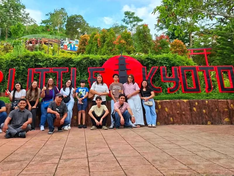 A Jushel tour group posing at the I love Little Kyoto sign