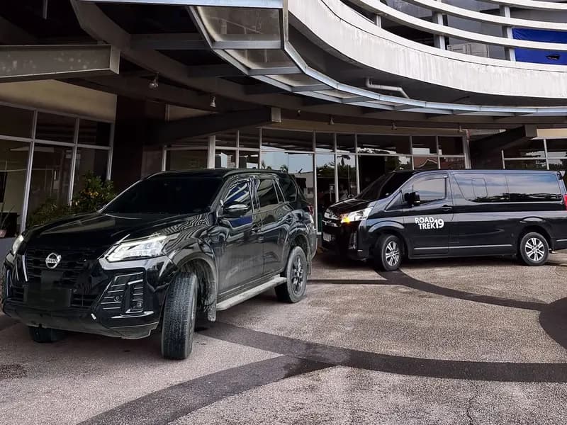 Black SUV and van parked outside a Cebu hotel