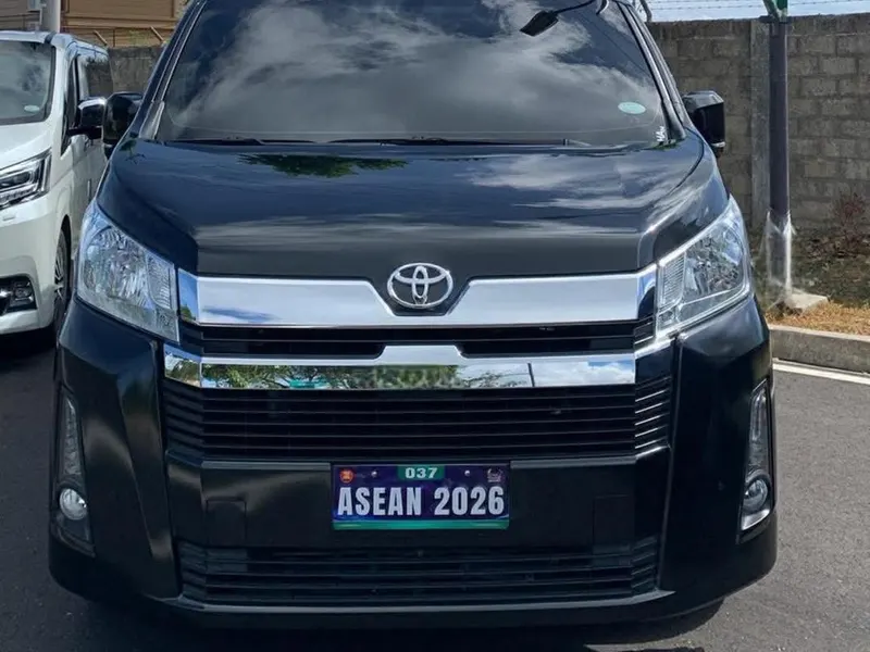 Front view of a black Toyota premium van